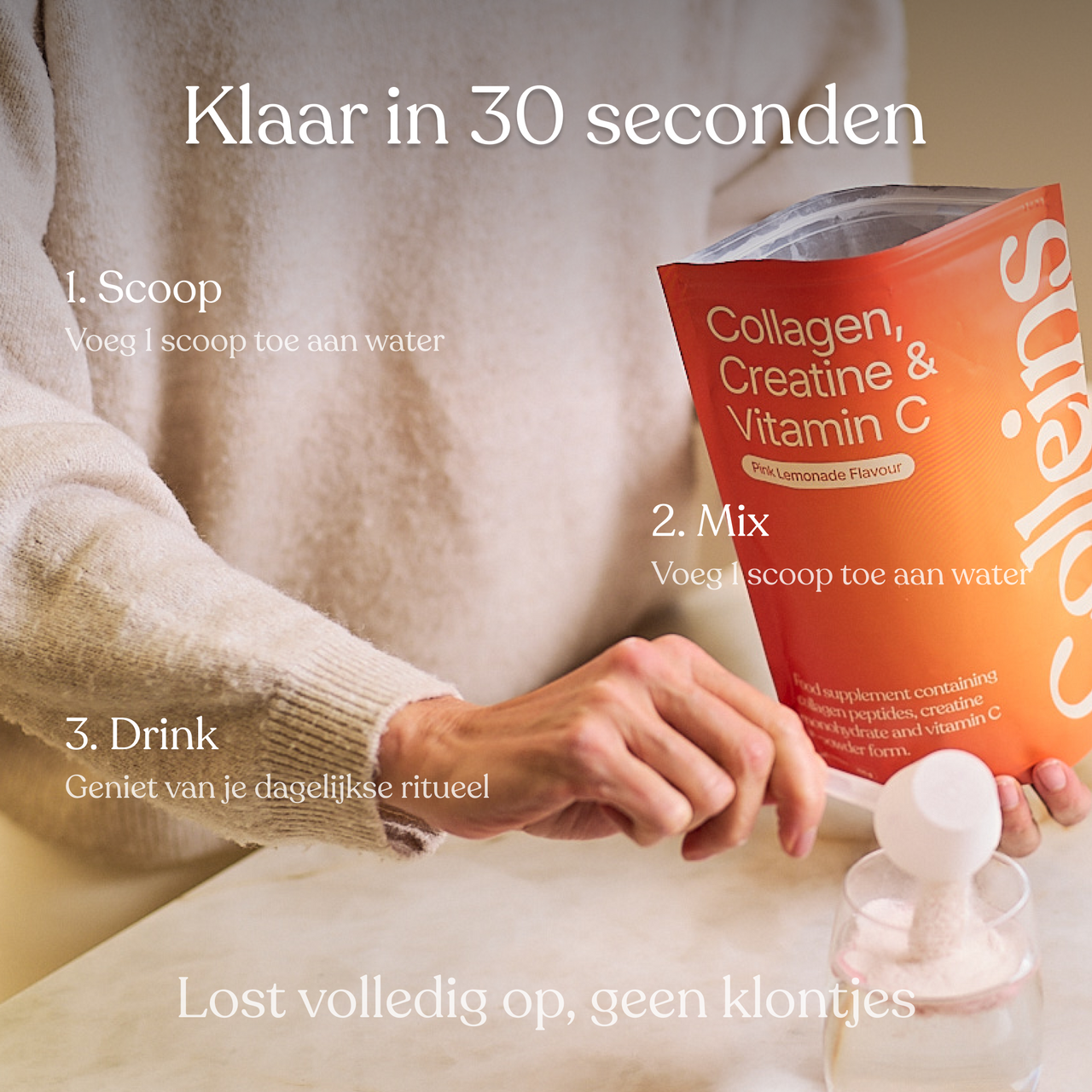 Colleins Pink Lemonade in a clear glass with ice and lemon slices, set against a light background.